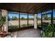 Enclosed patio area with tile flooring, clear views, and plants at 9980 Eagles Point Cir # 1, Port Richey, FL 34668