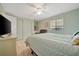 Bedroom offers light green walls, ample closet space, and natural lighting at 110 E Saint Lucia Loop, Apollo Beach, FL 33572