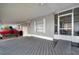 A covered deck next to a screened in porch allows for vehicle storage and outdoor living at 110 E Saint Lucia Loop, Apollo Beach, FL 33572