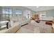 Bright and airy living space featuring large windows and comfortable seating at 110 E Saint Lucia Loop, Apollo Beach, FL 33572