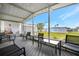 Relax on this spacious screened patio with modern furniture and nice views of the property and neighborhood at 110 E Saint Lucia Loop, Apollo Beach, FL 33572