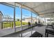 Spacious screened porch with outdoor seating and views of the surrounding community at 110 E Saint Lucia Loop, Apollo Beach, FL 33572