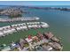 Aerial view of waterfront homes showing docks and water access at 11674 Grove St, Seminole, FL 33772