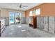 Spacious bedroom with concrete flooring, block wall, and sliding glass doors to the pool at 11674 Grove St, Seminole, FL 33772