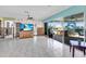 The spacious living room boasts tile floors and sliding glass doors to a back patio and hot tub at 11674 Grove St, Seminole, FL 33772