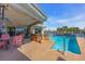 Relax in your private backyard oasis with a sparkling pool, hot tub, and covered patio at 11674 Grove St, Seminole, FL 33772