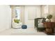 Bright Bedroom with crib, chair, and ottoman at 11808 Brae Way, Dade City, FL 33525