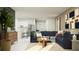 Cozy living room with open layout featuring a large sectional sofa and modern decor at 11808 Brae Way, Dade City, FL 33525