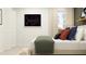 A spacious bedroom is decorated with stylish bedding, pillows, and a unique chalkboard art piece at 11808 Brae Way, Dade City, FL 33525