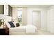 The bedroom is bright, with natural light, a large window, and elegant decor at 11808 Brae Way, Dade City, FL 33525