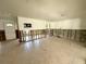 Open-concept living room featuring tile flooring and exposed drywall, ready for updates at 121 175Th E Ave, Redington Shores, FL 33708