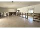 Spacious living room with tile flooring and exposed drywall, perfect for customization at 121 175Th E Ave, Redington Shores, FL 33708