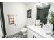 Bright bathroom featuring a modern vanity, toilet, and patterned tile flooring at 12335 Yellow Rose Cir, Riverview, FL 33569