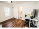 Bright bedroom with hardwood floors, a closet, an ensuite bathroom and work space at 12335 Yellow Rose Cir, Riverview, FL 33569