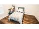 Cozy bedroom with hardwood floors and a comfortable, inviting atmosphere at 12335 Yellow Rose Cir, Riverview, FL 33569