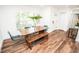 Bright dining room with wood table set and modern decor, perfect for Gathering dinners at 12335 Yellow Rose Cir, Riverview, FL 33569