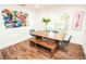 Bright dining room with wood table set and modern decor, perfect for Gathering dinners at 12335 Yellow Rose Cir, Riverview, FL 33569