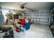 A spacious and well-lit garage featuring an automatic door and ample storage capacity at 12335 Yellow Rose Cir, Riverview, FL 33569