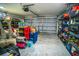 Bright garage featuring storage shelves and an automatic door, maximizing storage and convenience at 12335 Yellow Rose Cir, Riverview, FL 33569