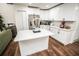 Spacious kitchen with stainless steel appliances, white cabinets, and a large center island at 12335 Yellow Rose Cir, Riverview, FL 33569