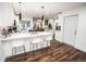 Bright kitchen with white cabinetry, stainless steel appliances, and modern bar seating at 12335 Yellow Rose Cir, Riverview, FL 33569