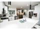 Open-concept kitchen with white cabinets, stainless steel appliances, and a large island at 12335 Yellow Rose Cir, Riverview, FL 33569