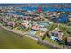 Aerial view of neighborhood featuring waterfront homes, community playground, and pool at 1408 Alhambra Dr, Apollo Beach, FL 33572