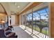A sun-drenched balcony looks over the canal and lush landscaping at 1408 Alhambra Dr, Apollo Beach, FL 33572