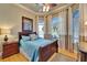 A charming bedroom is brightened by natural light streaming through the large windows at 1408 Alhambra Dr, Apollo Beach, FL 33572