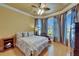Comfortable bedroom with many windows, hardwood floors, and stylish decor at 1408 Alhambra Dr, Apollo Beach, FL 33572