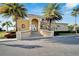 Exterior view of community clubhouse with attractive landscaping and beachfront access at 1408 Alhambra Dr, Apollo Beach, FL 33572