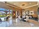 Elegant dining room featuring a chandelier, textured walls and a view to the pool and backyard at 1408 Alhambra Dr, Apollo Beach, FL 33572