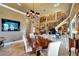 Spacious dining room with views of the upstairs landing, grand piano, and staircase at 1408 Alhambra Dr, Apollo Beach, FL 33572
