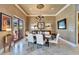 Sophisticated dining room with a dark wood table, seating for six, and natural lighting at 1408 Alhambra Dr, Apollo Beach, FL 33572