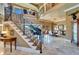 Grand foyer showcasing a staircase with wrought iron railings and access to dining area at 1408 Alhambra Dr, Apollo Beach, FL 33572