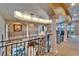Elegant foyer with wrought iron railings, grand staircase, and soaring ceilings at 1408 Alhambra Dr, Apollo Beach, FL 33572