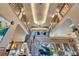 Grand foyer featuring soaring ceilings, a wrought iron staircase, and a gleaming chandelier at 1408 Alhambra Dr, Apollo Beach, FL 33572