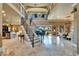 Gorgeous open floor plan with grand foyer, wrought iron staircase, marble floors, and formal dining at 1408 Alhambra Dr, Apollo Beach, FL 33572