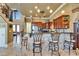 Stylish kitchen with granite countertops, breakfast bar, stainless appliances, and custom cabinetry at 1408 Alhambra Dr, Apollo Beach, FL 33572