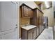 Spacious laundry room with custom cabinets, granite countertops, a utility sink and washer and dryer units at 1408 Alhambra Dr, Apollo Beach, FL 33572