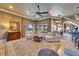 Elegant living room with plush seating, large windows, a decorative rug, and access to dining area at 1408 Alhambra Dr, Apollo Beach, FL 33572
