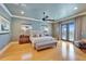 This spacious main bedroom features light hardwood floors and balcony access at 1408 Alhambra Dr, Apollo Beach, FL 33572