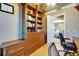 This home office boasts an exquisite custom built-in bookcase with drawers at 1408 Alhambra Dr, Apollo Beach, FL 33572