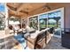 Outdoor patio with comfortable seating, ceiling fans, and sliding glass doors to the backyard at 1408 Alhambra Dr, Apollo Beach, FL 33572