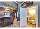 The Personal Cave boasts a stylish bar with granite countertop that opens into a half bath, creating an entertaining space at 1408 Alhambra Dr, Apollo Beach, FL 33572