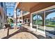 Pool and patio with covered seating area and view of pond at 1408 Alhambra Dr, Apollo Beach, FL 33572