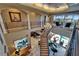 Staircase with views to the kitchen, dining room and backyard pool area at 1408 Alhambra Dr, Apollo Beach, FL 33572
