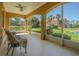 This screened balcony offers a view of manicured lawns and nearby townhouses at 16 Franklin S Ct # A, St Petersburg, FL 33711