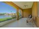 A screened balcony provides a scenic view of a tranquil lake with a fountain at 16 Franklin S Ct # A, St Petersburg, FL 33711