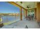 A screened balcony overlooks a serene lake, creating a peaceful outdoor retreat at 16 Franklin S Ct # A, St Petersburg, FL 33711